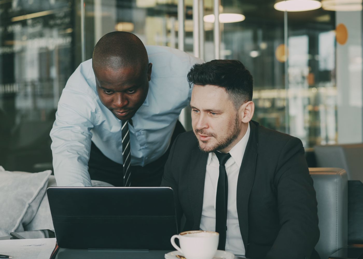 A compliance advisor working through a plan with a colleague