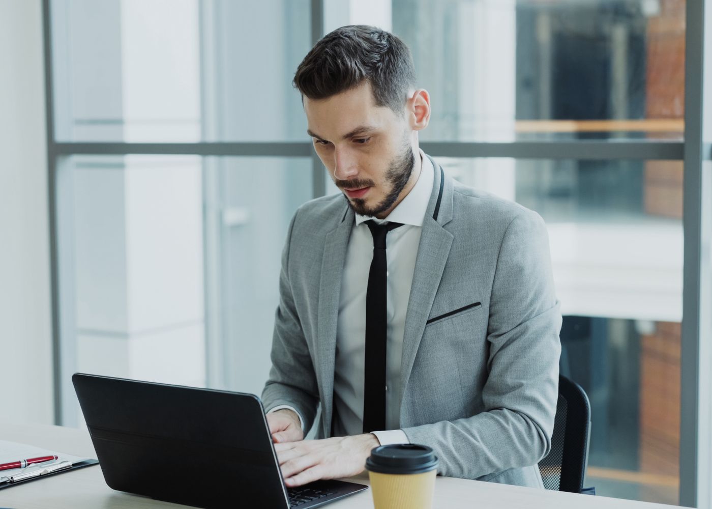 A professional working securely on a laptop