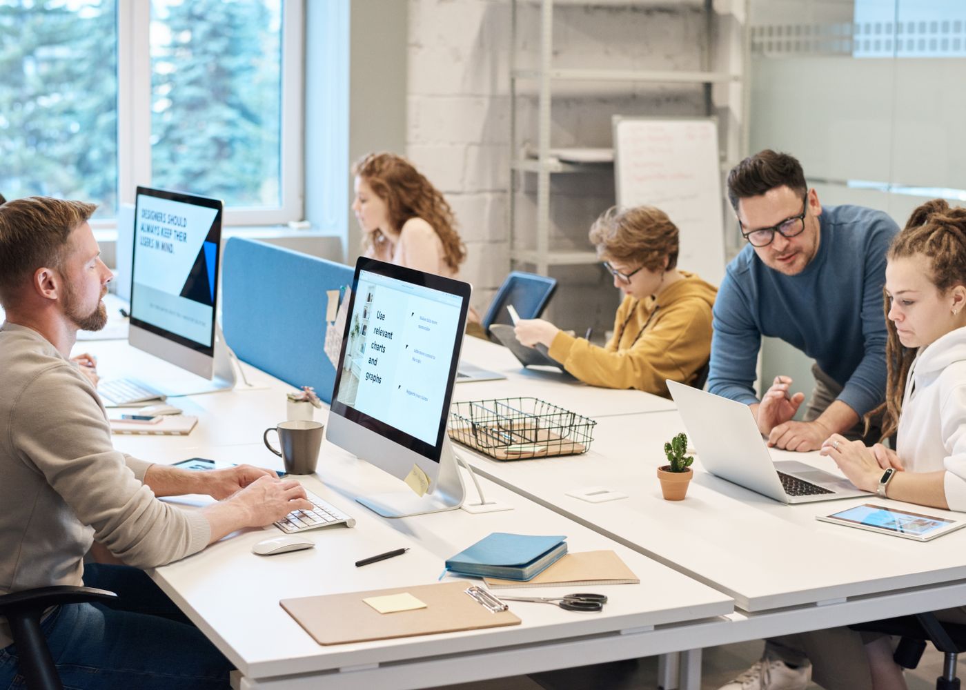 A team handling personal data on their computers
